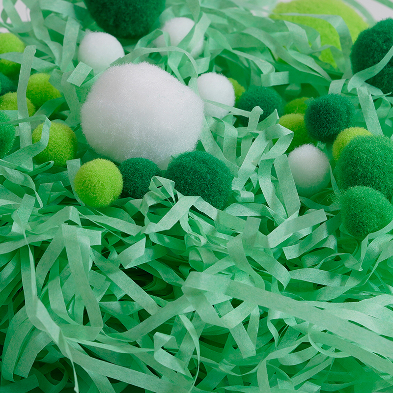 Boule à pompons avec raphia